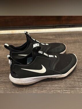 Nike Black Slip-On Sneakers with White Swoosh